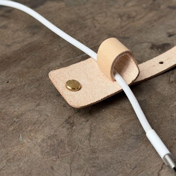 彈性有餘束線器 