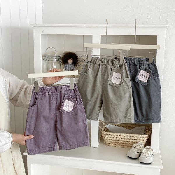 三隻狗狗吊牌感素色長褲 