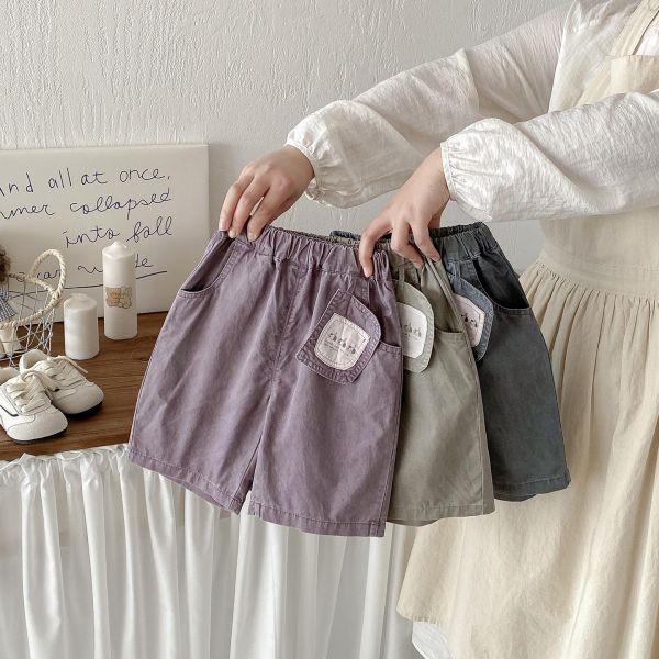 三隻狗狗吊牌感素色長褲 