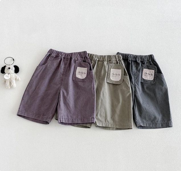 三隻狗狗吊牌感素色長褲 