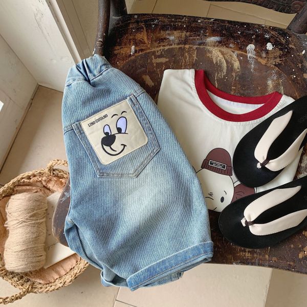 水洗暈染可愛布標七分牛仔褲 