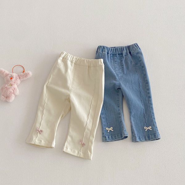 波紋剪裁蝴蝶結兩色牛仔長褲 