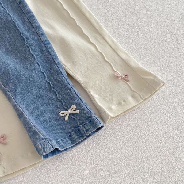 波紋剪裁蝴蝶結兩色牛仔長褲 