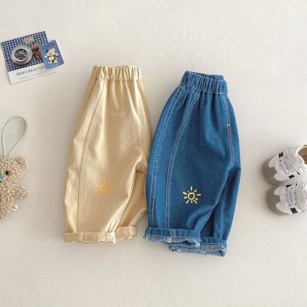 極簡太陽刺繡牛仔休閒長褲 