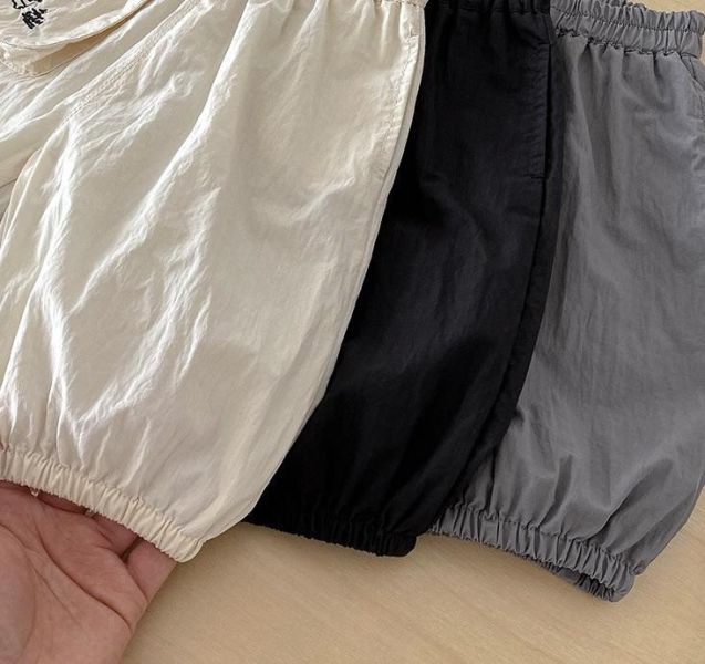 素色口袋塗鴉You字母束口褲 