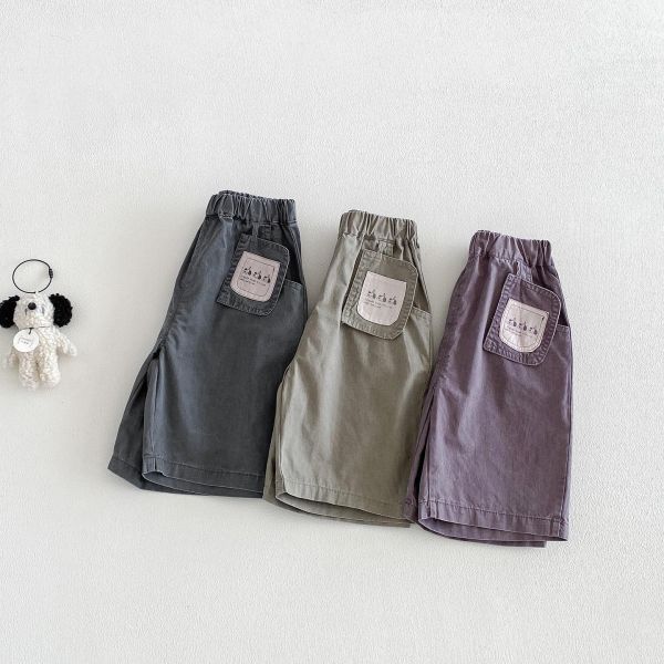 三隻狗狗吊牌感素色長褲 