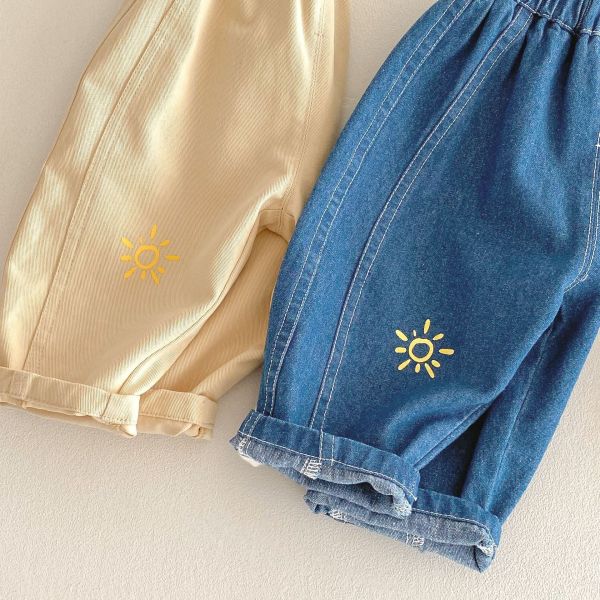 極簡太陽刺繡牛仔休閒長褲 