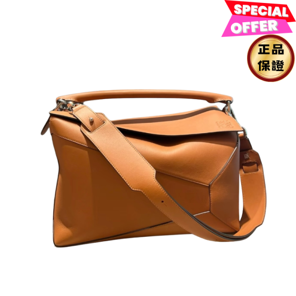 Loewe 經典小牛皮革大款 Puzzle 包    新尺寸/焦糖色 Loewe、Puzzle、大款puzzle包、焦糖色包包、小牛皮包、幾何包、三用包、精品包款、精品包推薦、大包款推薦、實用包款推薦、精品包評價、精品包價格、平行輸入、精品平行輸入、100%真品、專櫃真品保證、精品折扣、優惠精品價格、限時優惠、快速配送、台灣精品代購、精品包包哪裡買、精品包專櫃價格