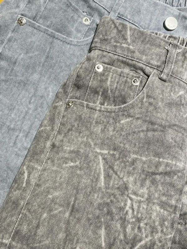 街頭紋路水洗後鬆緊褲管調節鐵扣牛仔寬褲 