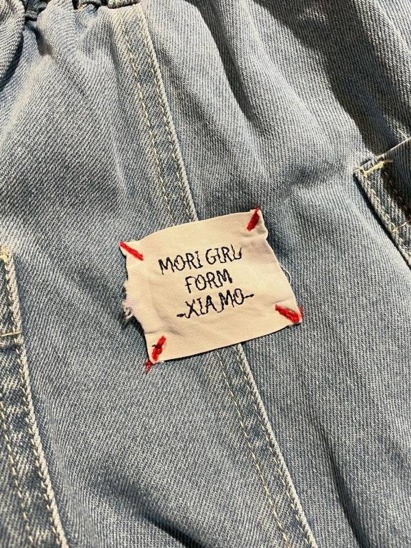 後布標雙口袋圓形車線鬆緊腰九分牛仔寬褲 