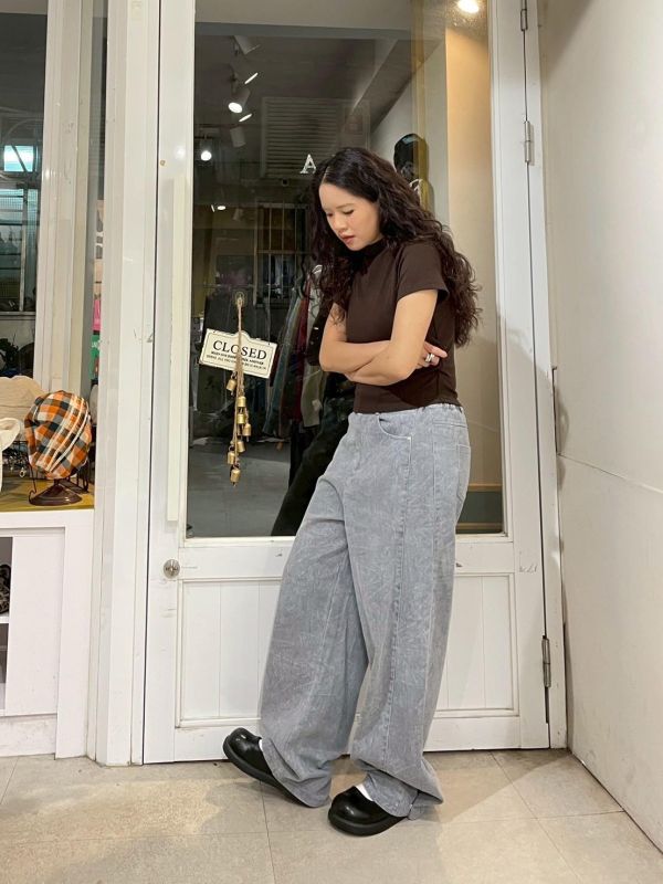 街頭紋路水洗後鬆緊褲管調節鐵扣牛仔寬褲 