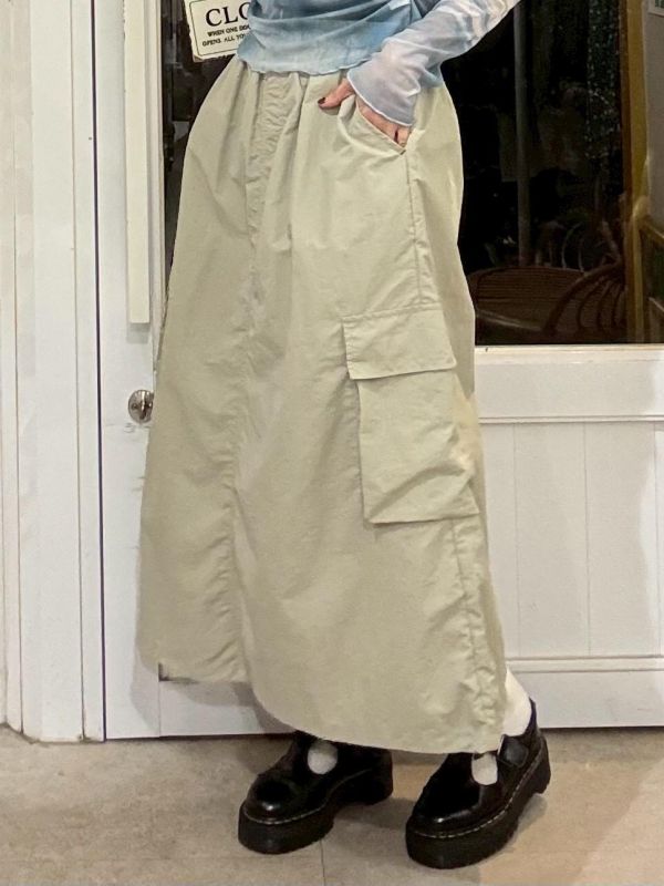 伸縮腰刷刷布兩側立體大口袋下擺抽繩A字長裙 