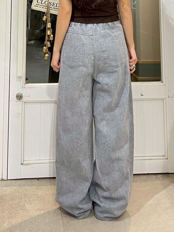 街頭紋路水洗後鬆緊褲管調節鐵扣牛仔寬褲 