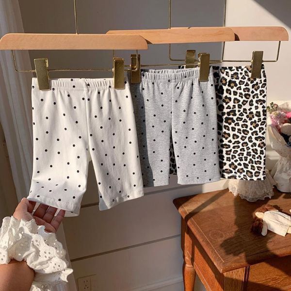 滿印波點彈力五分褲 