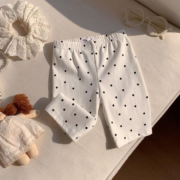 滿印波點彈力五分褲 