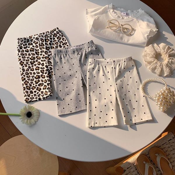 滿印波點彈力五分褲 