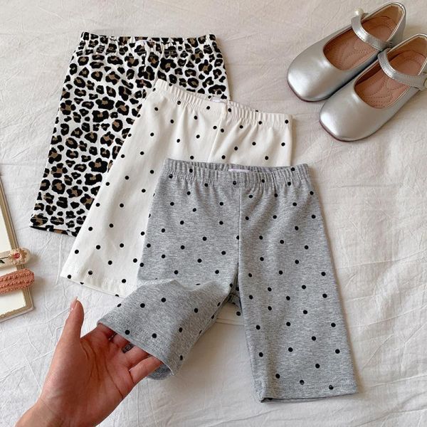 滿印波點彈力五分褲 