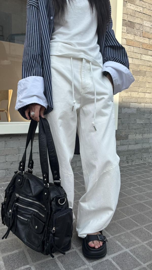 抽繩彎刀牛仔褲 