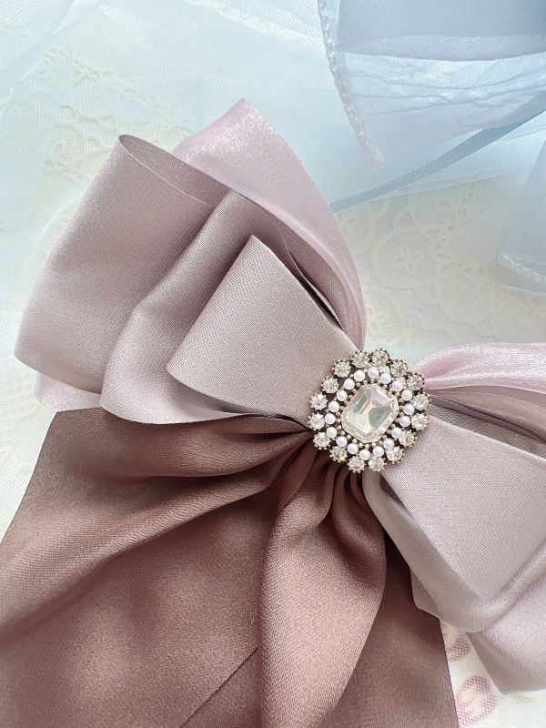 硬板立體蝴蝶結水鑽雕花彈跳夾 