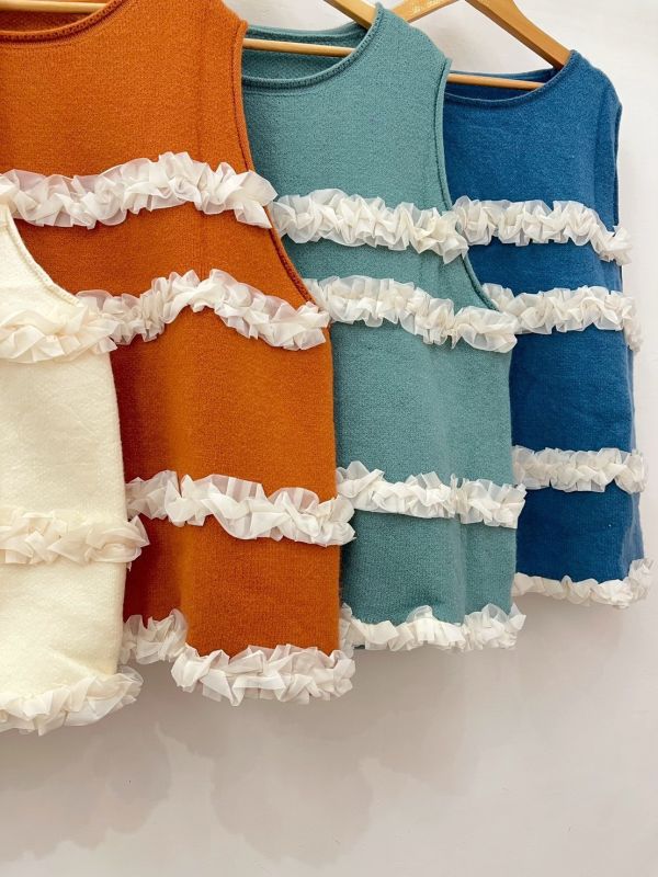 A09層層雪花毛背心 