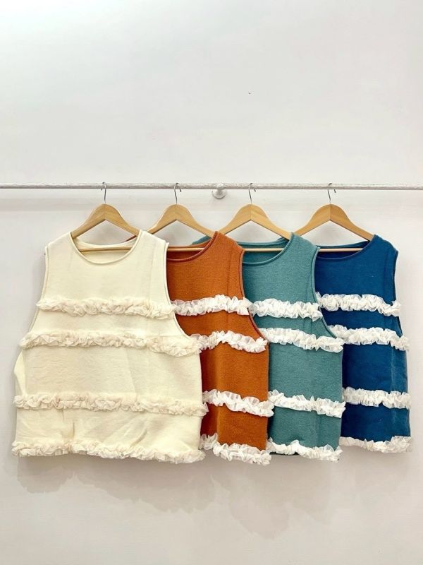 A09層層雪花毛背心 