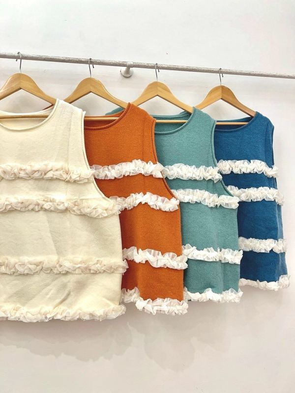 A09層層雪花毛背心 