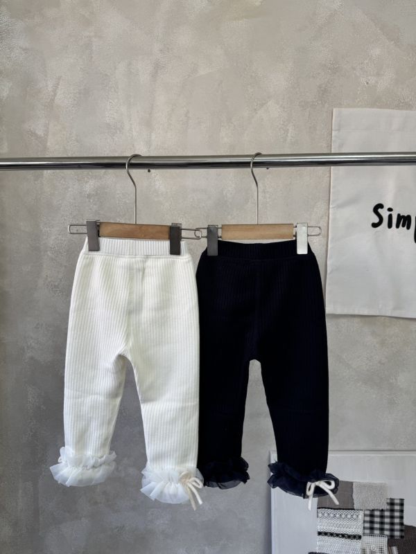 仙女的拼紗坑條蝴蝶結微刷毛內搭長褲 