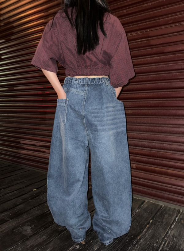 韓版反向弧線牛仔寬褲 