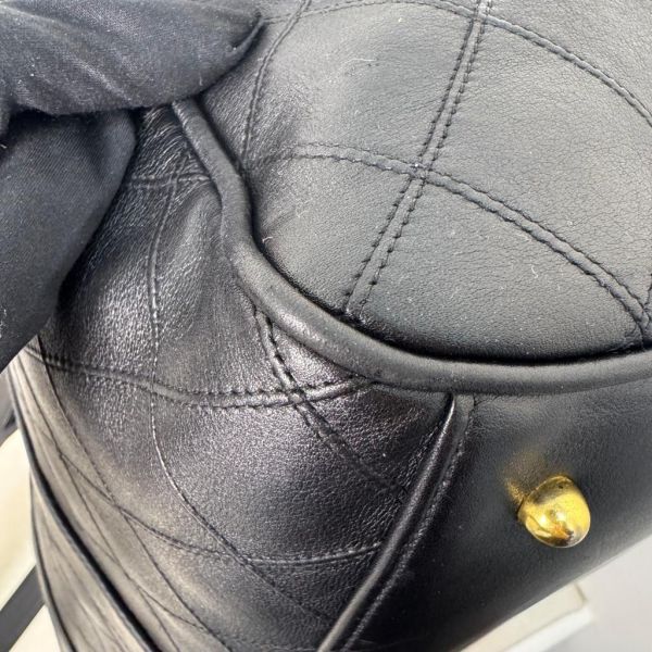 Chanel 菱格紋黑金旅行袋 