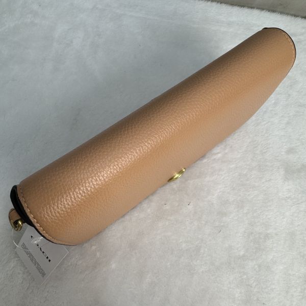 Coach 粉拋光鵝卵石斜背包 