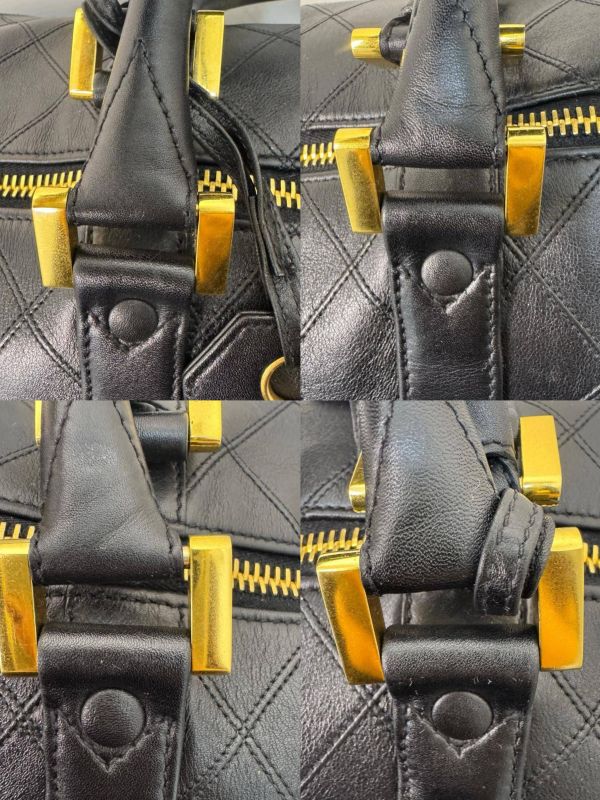 Chanel 菱格紋黑金旅行袋 