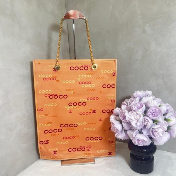 CHANEL 粉紅色帆布COCO印花包 