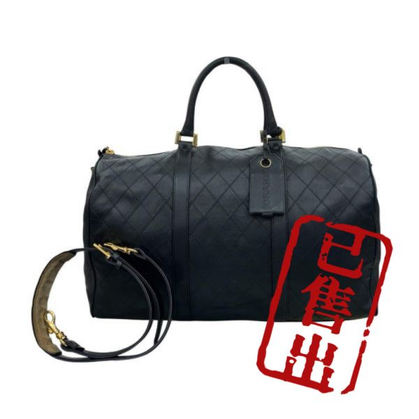 Chanel 菱格紋黑金旅行袋 